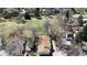 Aerial view of a home with a well-maintained roof, surrounded by mature trees and lush greenery in a serene neighborhood setting at 6396 Twin Lakes Rd, Boulder, CO 80301
