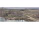 Scenic aerial view showcases a peaceful walking path by the water at 6396 Twin Lakes Rd, Boulder, CO 80301