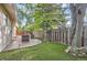 Backyard features pavers, a built-in fire pit, and a large grassy area at 6396 Twin Lakes Rd, Boulder, CO 80301
