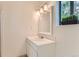 Bright bathroom with an attractive sink, vanity, mirror and light fixture at 6396 Twin Lakes Rd, Boulder, CO 80301