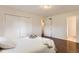 Bedroom features hardwood floors and a large closet with double doors at 6396 Twin Lakes Rd, Boulder, CO 80301