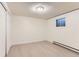 Bright bedroom featuring modern vinyl floors, a window, closet and neutral paint at 6396 Twin Lakes Rd, Boulder, CO 80301