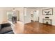 Open living room with hardwood floors, and a view of the dining area and kitchen at 6396 Twin Lakes Rd, Boulder, CO 80301