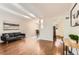 Bright living room featuring wood floors, a modern sofa, and tasteful decor at 6396 Twin Lakes Rd, Boulder, CO 80301