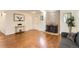 Cozy living room with wood floors, a stone fireplace, and a comfortable sofa at 6396 Twin Lakes Rd, Boulder, CO 80301