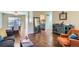 Open-concept living area with hardwood floors, connecting to the dining and kitchen spaces, creating an airy atmosphere at 6396 Twin Lakes Rd, Boulder, CO 80301