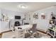 Home office with a sit-stand desk, comfortable seating, and ample storage space at 6396 Twin Lakes Rd, Boulder, CO 80301