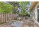 Backyard patio featuring pavers, an outdoor seating area and a wood fence at 6396 Twin Lakes Rd, Boulder, CO 80301