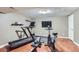 Basement workout room with a treadmill, rowing machine, and stationary bike at 6396 Twin Lakes Rd, Boulder, CO 80301