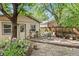 Backyard featuring a stone patio with seating, garden, and privacy fence at 2253 N Williams St, Denver, CO 80205