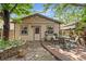 Backyard with patio seating, garden beds, and string lights for outdoor relaxation at 2253 N Williams St, Denver, CO 80205