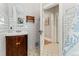 Cozy bathroom featuring a classic sink, white subway tiles, and patterned mosaic flooring at 2253 N Williams St, Denver, CO 80205