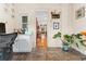 Dining area with tiled floor and a view to living area with hardwood floors at 2253 N Williams St, Denver, CO 80205