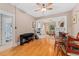 Open concept dining room with hardwood floors, built-in shelving, and view to living room at 2253 N Williams St, Denver, CO 80205