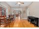 Light-filled dining area showcasing hardwood floors and open access to kitchen at 2253 N Williams St, Denver, CO 80205