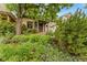 Charming home with lush landscaping leading up to the inviting front porch and secure front door at 2253 N Williams St, Denver, CO 80205