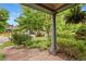 Covered front porch with a view of the well-maintained landscaping and a glimpse of the neighborhood at 2253 N Williams St, Denver, CO 80205