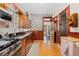 Updated kitchen featuring modern appliances, granite countertops, and stylish patterned backsplash at 2253 N Williams St, Denver, CO 80205