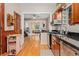 Kitchen boasting stainless appliances, granite countertops, hardwood floors, and view to living room at 2253 N Williams St, Denver, CO 80205