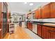 Spacious kitchen with stainless steel appliances, hardwood floors, and an open view to the dining room at 2253 N Williams St, Denver, CO 80205