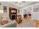 Inviting living room with a decorative fireplace, hardwood floors, and a seamless flow into the dining area at 2253 N Williams St, Denver, CO 80205