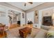Bright living room featuring hardwood floors, classic moldings, stylish furniture, and ample natural light at 2253 N Williams St, Denver, CO 80205