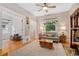 Cozy living room with hardwood floors, stylish furniture, and view of the front door at 2253 N Williams St, Denver, CO 80205