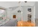 Bedroom offering a ceiling fan, natural light, walk in closet, and hardwood floors at 2253 N Williams St, Denver, CO 80205