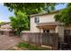 Well-maintained backyard with a fence, shed, patio, and lush trees at 8126 Gray Ct # 499, Arvada, CO 80003