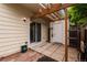 A backyard patio with a white shed, patio, privacy fence, and sliding glass door at 8126 Gray Ct # 499, Arvada, CO 80003