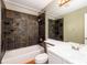 Bathroom with dark tile shower, white countertops, and neutral walls at 8126 Gray Ct # 499, Arvada, CO 80003
