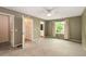 A carpeted bedroom with neutral walls, white trim, and a ceiling fan with lighting at 8126 Gray Ct # 499, Arvada, CO 80003