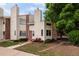 Charming two-story townhouse with brick accents and a well-maintained front yard for sale at 8126 Gray Ct # 499, Arvada, CO 80003
