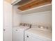 Laundry room with white washer and dryer, as well as white shelving for storage at 8126 Gray Ct # 499, Arvada, CO 80003