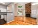 Inviting space with hardwood floors, a stone fireplace, and views of the kitchen at 8126 Gray Ct # 499, Arvada, CO 80003