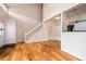 Bright living room with hardwood floors and staircase to the second floor at 8126 Gray Ct # 499, Arvada, CO 80003
