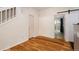 Open-concept space with hardwood floors and a sliding barn door at 8126 Gray Ct # 499, Arvada, CO 80003