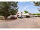 Community parking area with covered parking spots and mature trees at Lake Arbor Village at 8126 Gray Ct # 499, Arvada, CO 80003