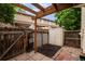 Enclosed backyard patio featuring a privacy fence, patio, a small storage shed and garden at 8126 Gray Ct # 499, Arvada, CO 80003