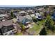 Aerial shot of a home with a large backyard featuring a deck and fire pit seating area at 16652 W Archer Ave, Golden, CO 80401