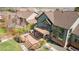 Aerial view of the home's backyard featuring a custom deck with a fire pit and grilling area at 16652 W Archer Ave, Golden, CO 80401