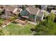 Aerial view of home showing deck with outdoor kitchen, garden and abundant greenery at 16652 W Archer Ave, Golden, CO 80401