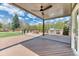 Large backyard deck with a built-in grill, stone fire pit, and plenty of space for outdoor entertaining at 16652 W Archer Ave, Golden, CO 80401