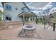 Well-designed backyard deck featuring a fire pit, grill, and seamless access to the home's interior at 16652 W Archer Ave, Golden, CO 80401