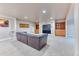 Finished basement boasts a cozy entertainment area with built-in shelving and a large flatscreen television at 16652 W Archer Ave, Golden, CO 80401