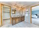 Bathroom with double vanity and pendant lights, with a walk-in closet on one side at 16652 W Archer Ave, Golden, CO 80401