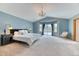 Bright Primary bedroom with a chandelier, bay window, and neutral color palette at 16652 W Archer Ave, Golden, CO 80401