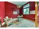 Home office features an accent wall, natural light, and space for work and relaxation at 16652 W Archer Ave, Golden, CO 80401