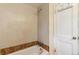 Tile bathroom with a bathtub and shower at 1175 Xanthia, Denver, CO 80220