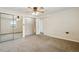 Spacious main bedroom with mirrored closet doors, and neutral carpet at 1175 Xanthia, Denver, CO 80220
